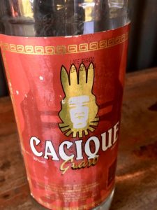 A bottle of Cacique: potent fermented sugar cane alcohol.