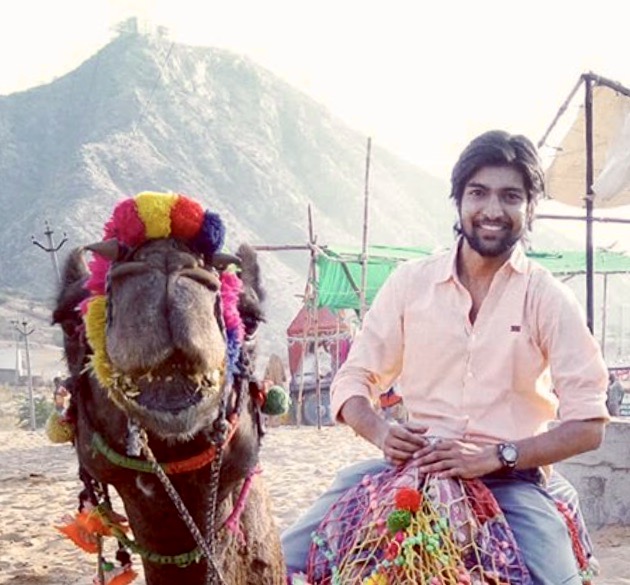 Photo of Niks riding a camel.
