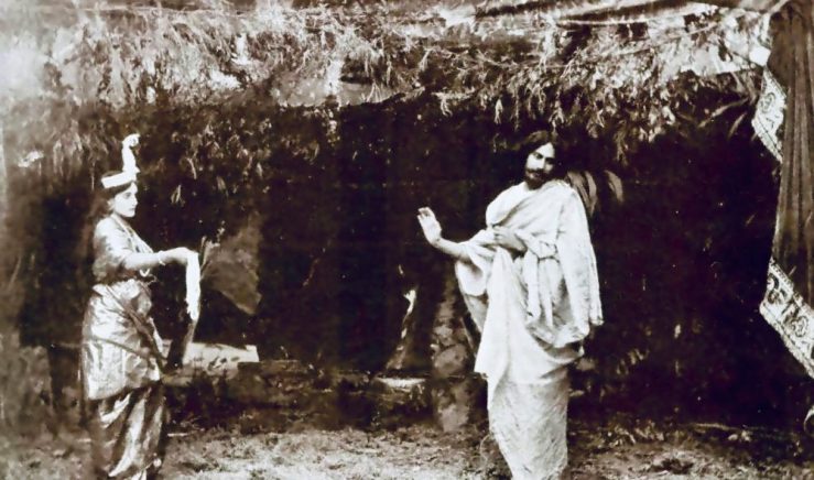 Tagore performing the title role inValmiki Pratibha (1881) with his niece Indira Devi as the goddess Lakshmi, by unknown author - Indira Devi Chowdhurani. Rabindra Smriti — Kolkata: Visva-Bharati, 1974., Public Domain, https://commons.wikimedia.org/w/index.php?curid=16150280